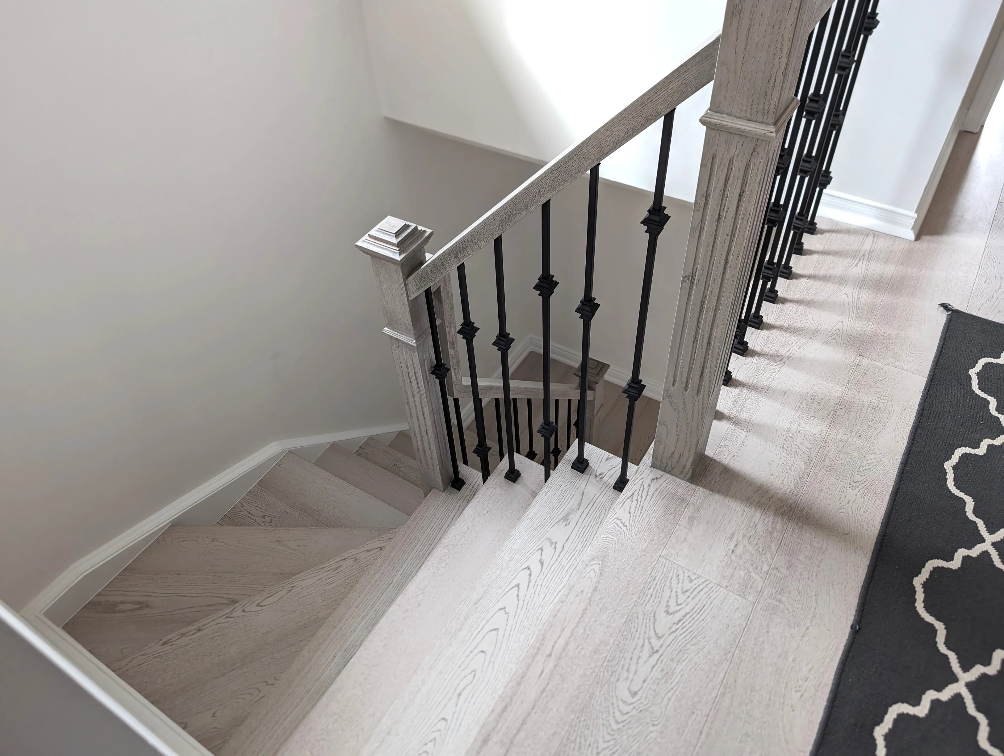 Custom stair tread detail fabricated to match existing hardwood flooring